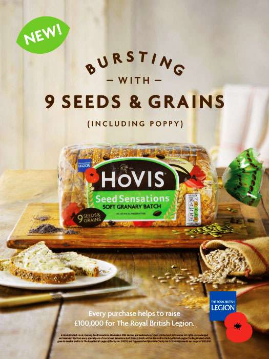 Hovis bread Advertising photography by West London Food Photographer Michael Michaels, showing a loaf of seeded brerad with buttered slices in a country kitchen setting.