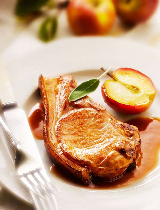 Pork Chop with Roasted apple and Sage by London Food Photographer Michael Michaels