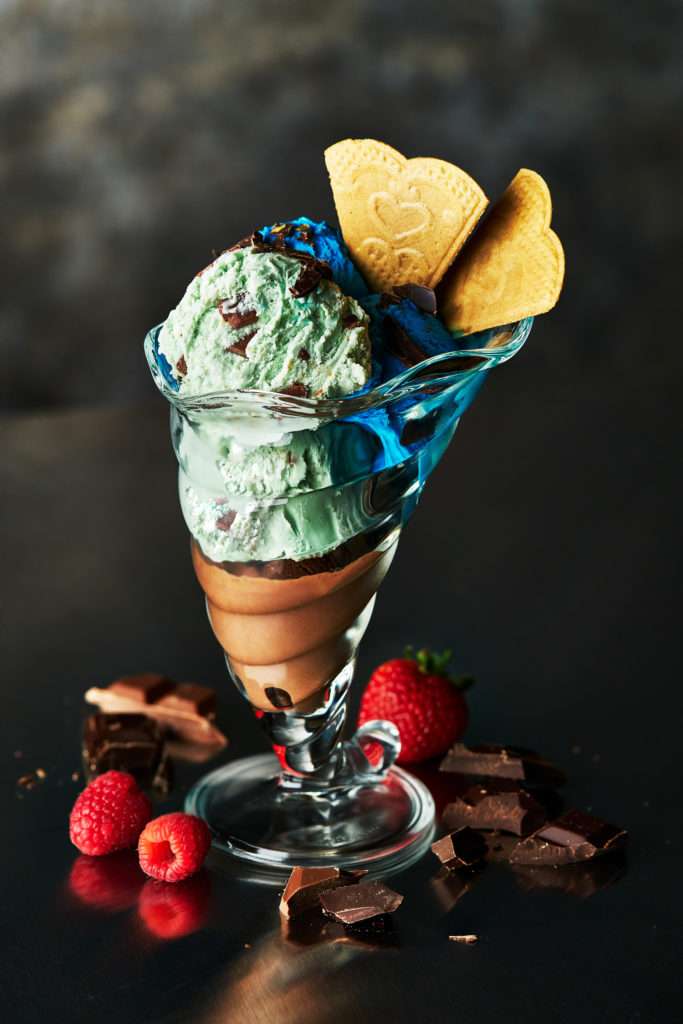 Photo of Ice cream Sundae on dark background by Food Photographer Michael Michaels